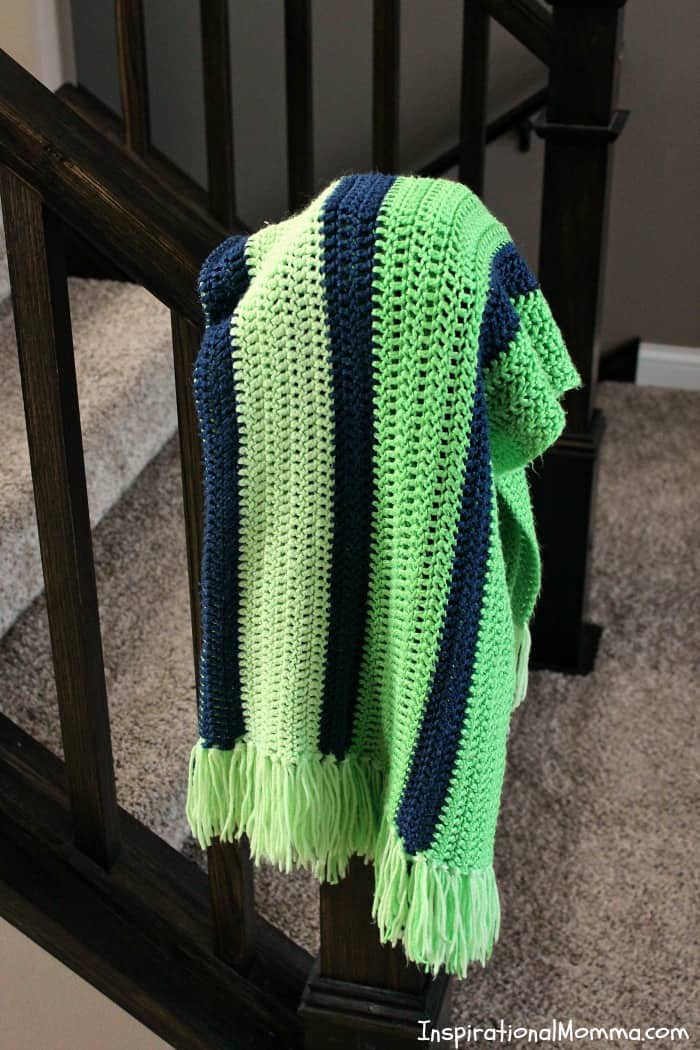 This Double Crochet Striped Blanket is a perfect project for any crocheter! Using only a double crochet stitch, it is so simple, anyone can do it! double crochet, crochet, #inspirationalmomma #homemade #diy #howtocrochet #crocheting #beginning #easy #simple