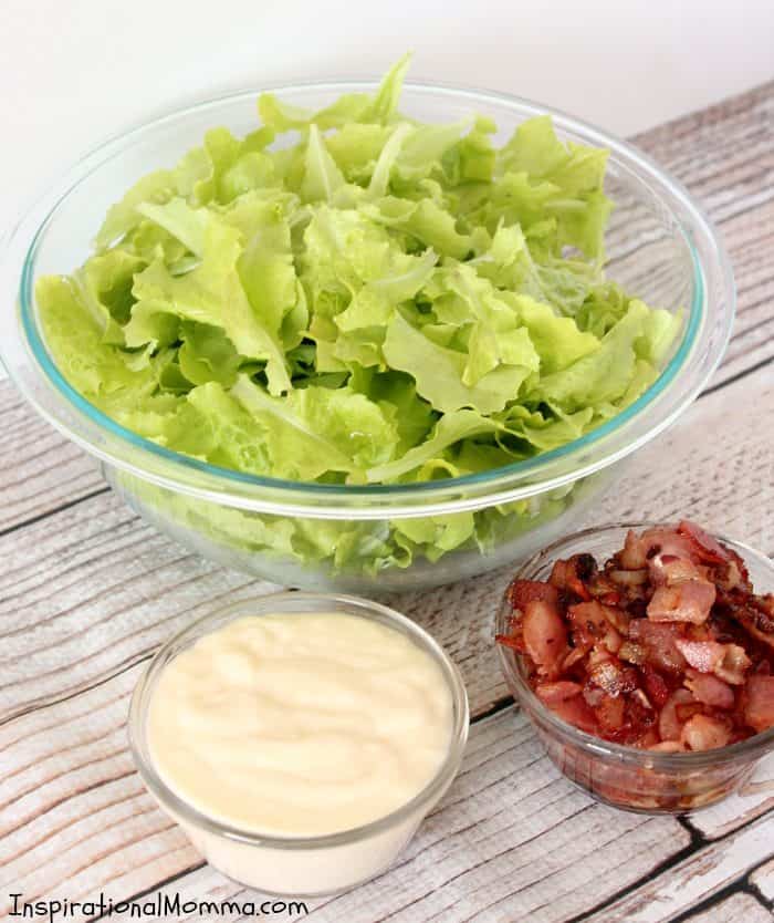This Fresh and Sweet Garden Salad has a perfect combination of ingredients! Crisp lettuce, bacon, and onions smothered in a creamy, sweet sauce!