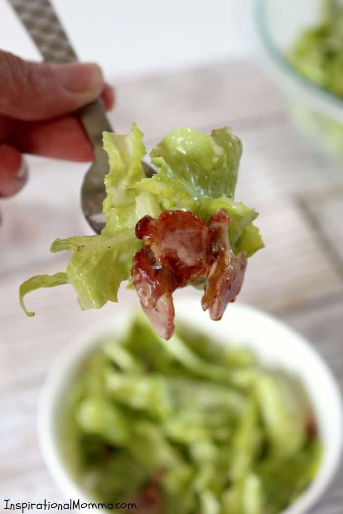 This Fresh and Sweet Garden Salad has a perfect combination of ingredients! Crisp lettuce, bacon, and onions smothered in a creamy, sweet sauce!