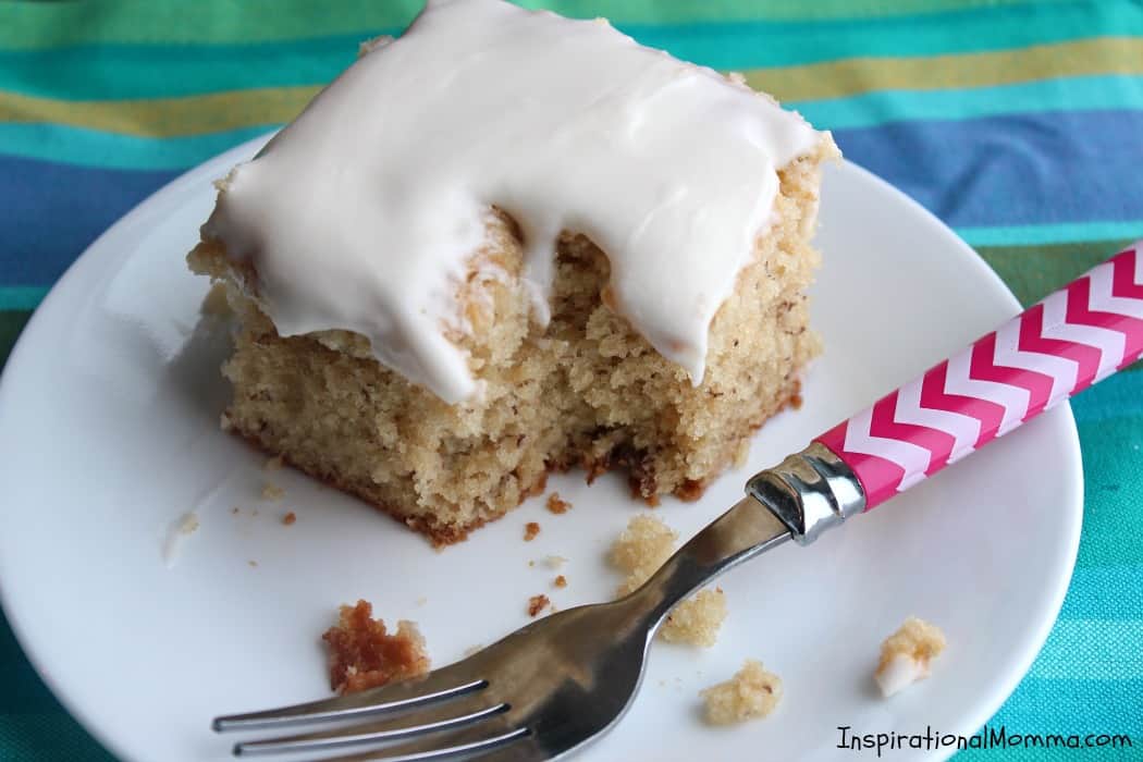 This Banana Cake with Cream Cheese Frosting is so moist and soft it melts in your mouth. Covered in creamy cream cheese frosting, it is complete perfection!