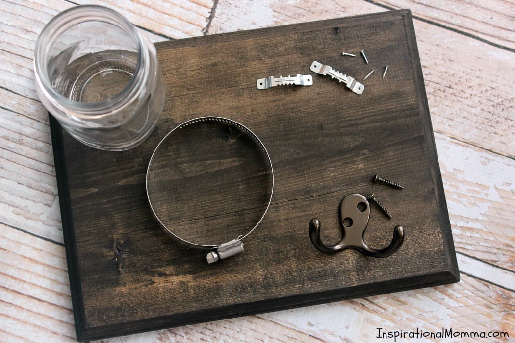 This DIY Dog Treat & Leash Station conveniently stores treats and a leash while adding a personal touch to a dog-lover's decor!