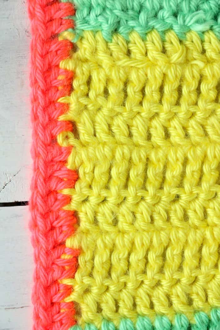 This Varied Double Crochet Triple Crochet Blanket is a perfect project for any crocheter. The stitches are simple and the colors are fun and vibrant! #InspirationalMomma #doublecrochet #triplecrochet #crochet #crochetpattern #freepattern