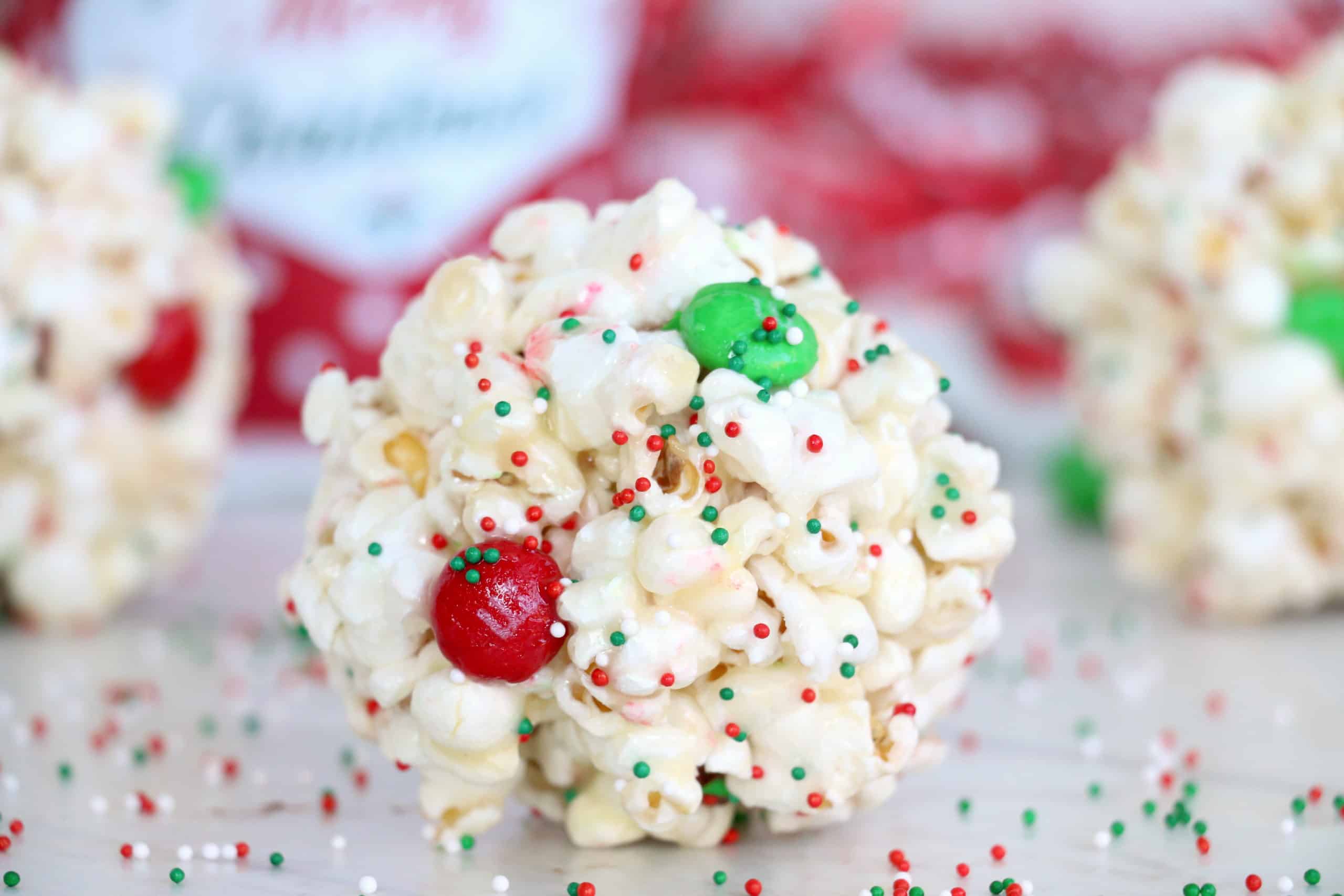 Easy Popcorn Balls are a perfect sweet, delicious treat for any occassion. This old-fashioned recipe is sure to put a smile on everyone's face! #inspirationalmomma #easypopcornballs #popcornballsrecipe #recipe #dessert #sweet #easy #Christmas #holidays