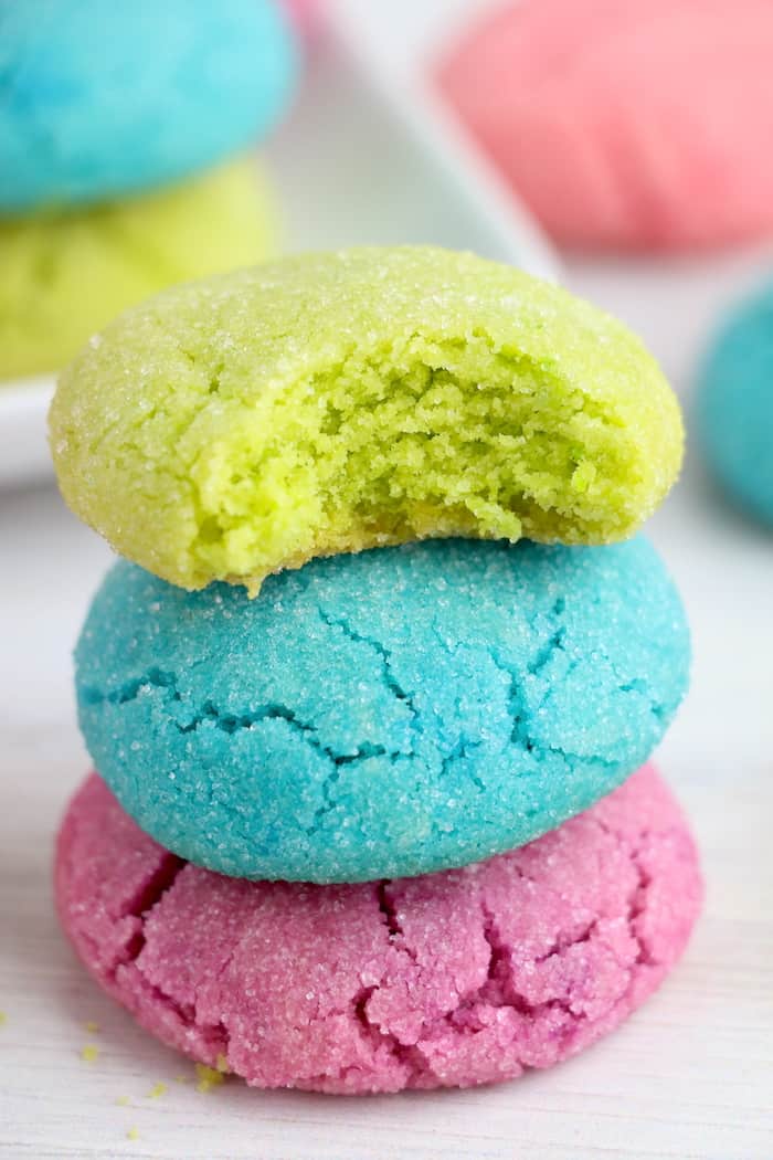 Colorful sugar cookies stacked up.