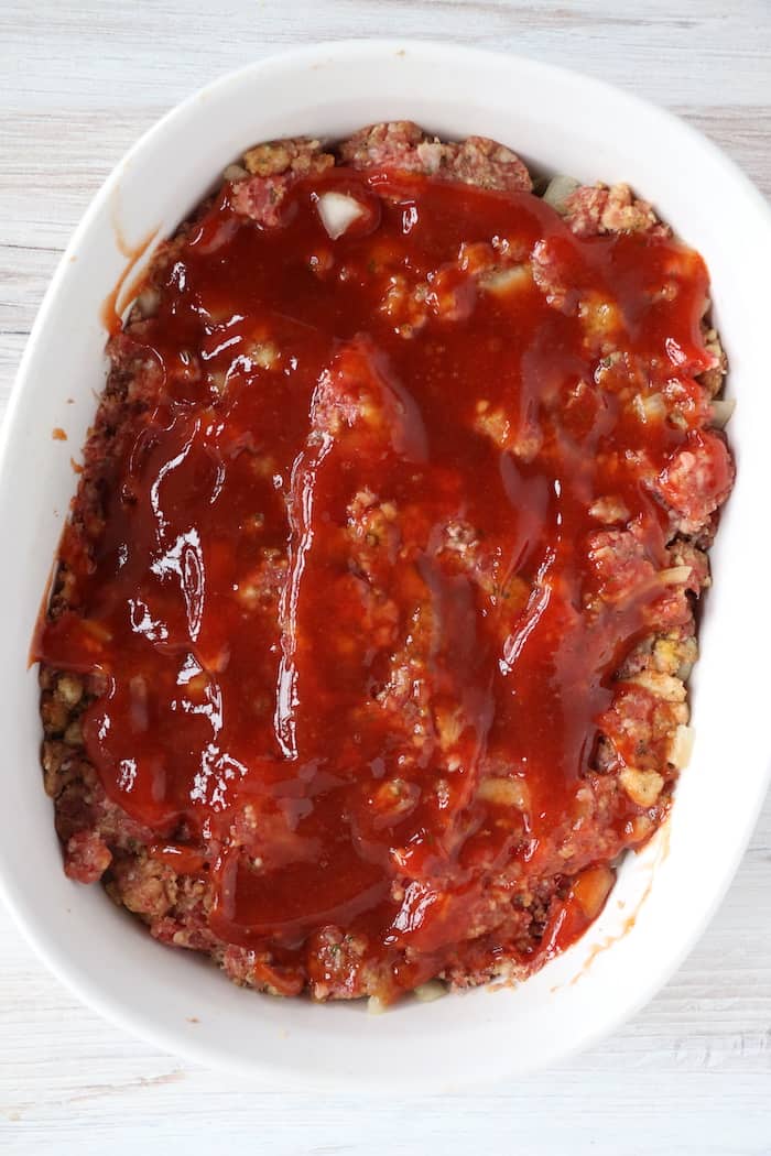 Meatloaf in a baking dish, ready to go into the oven.
