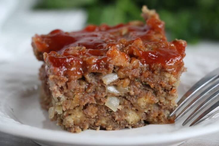 Homemade Meatloaf on a small white plate.