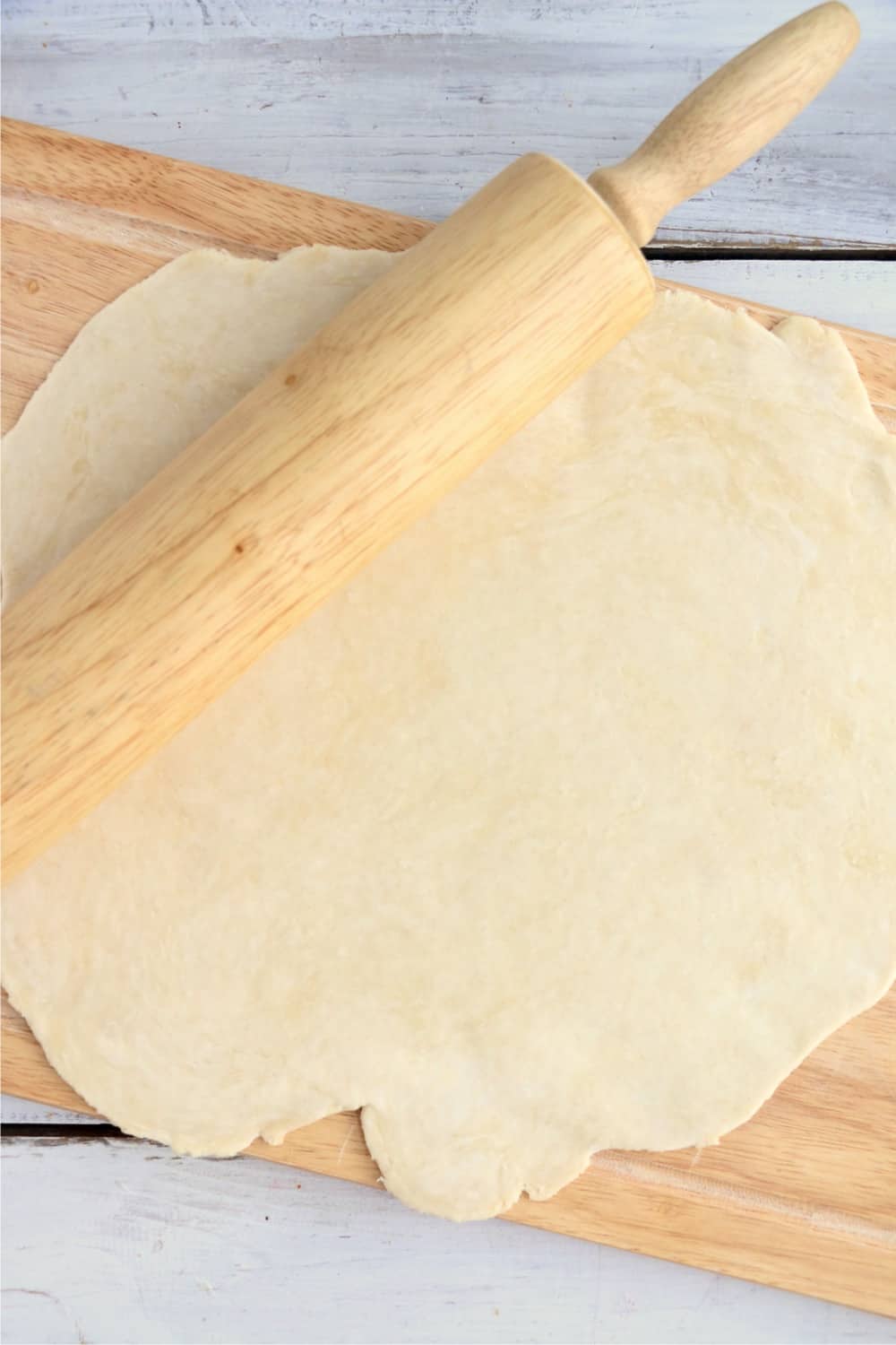 Rolling out pie crust.