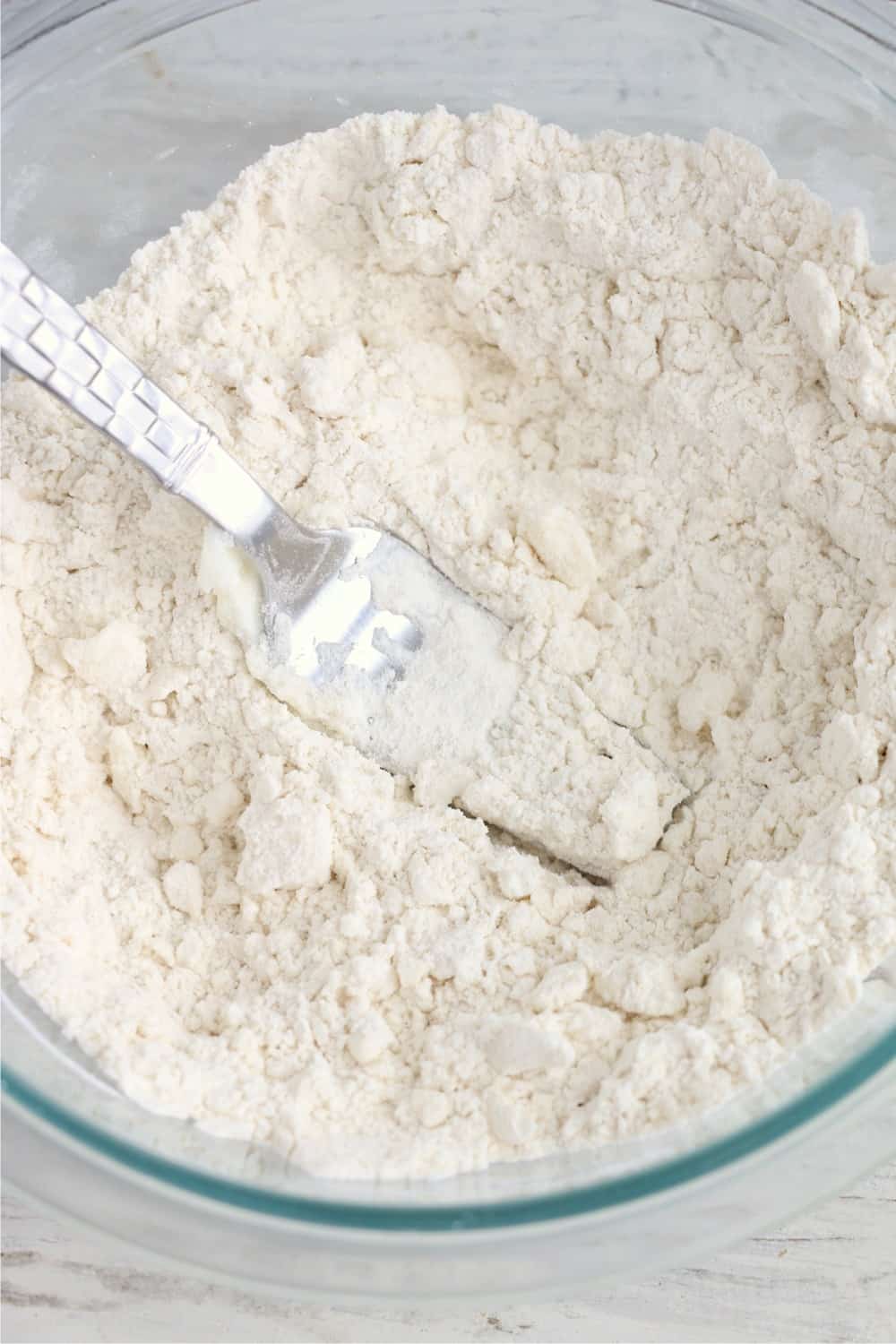 Cutting butter into flour.
