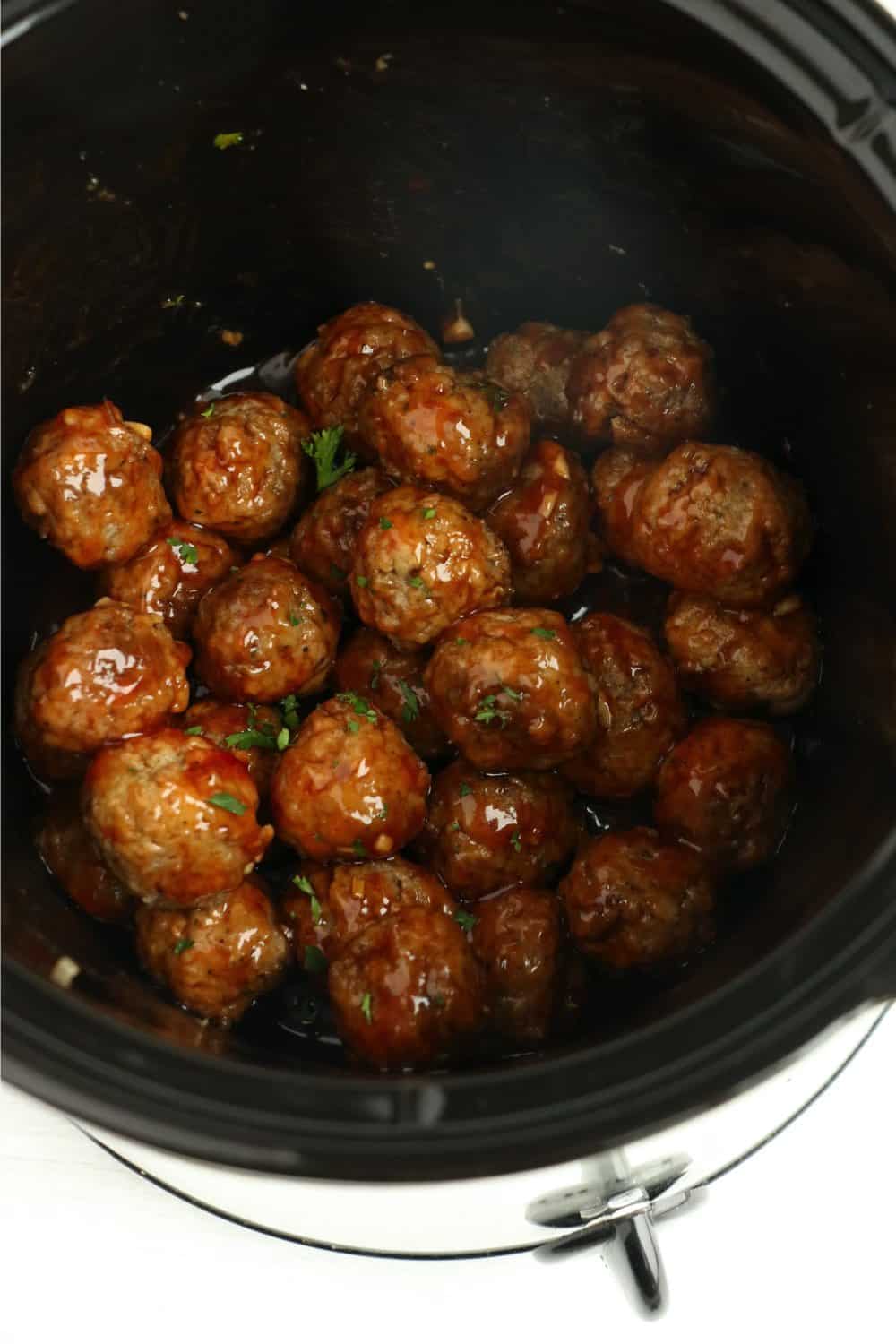 Honey garlic meatballs cooking in the crock pot.