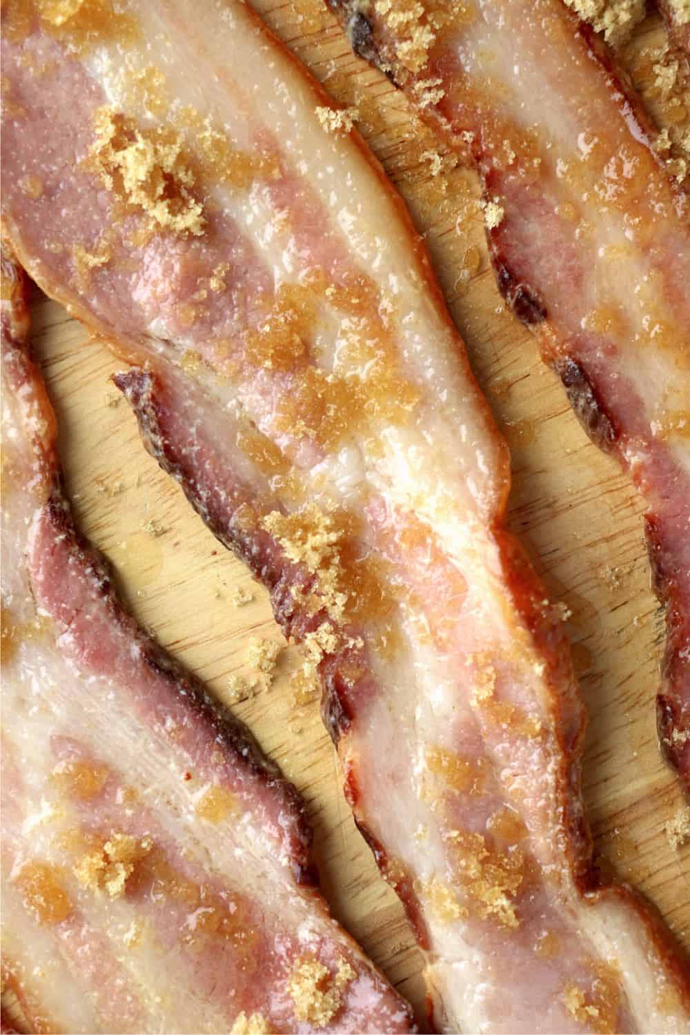 Strips of bacon with a delicious mixture of melted butter, salt and garlic powder brushed on them