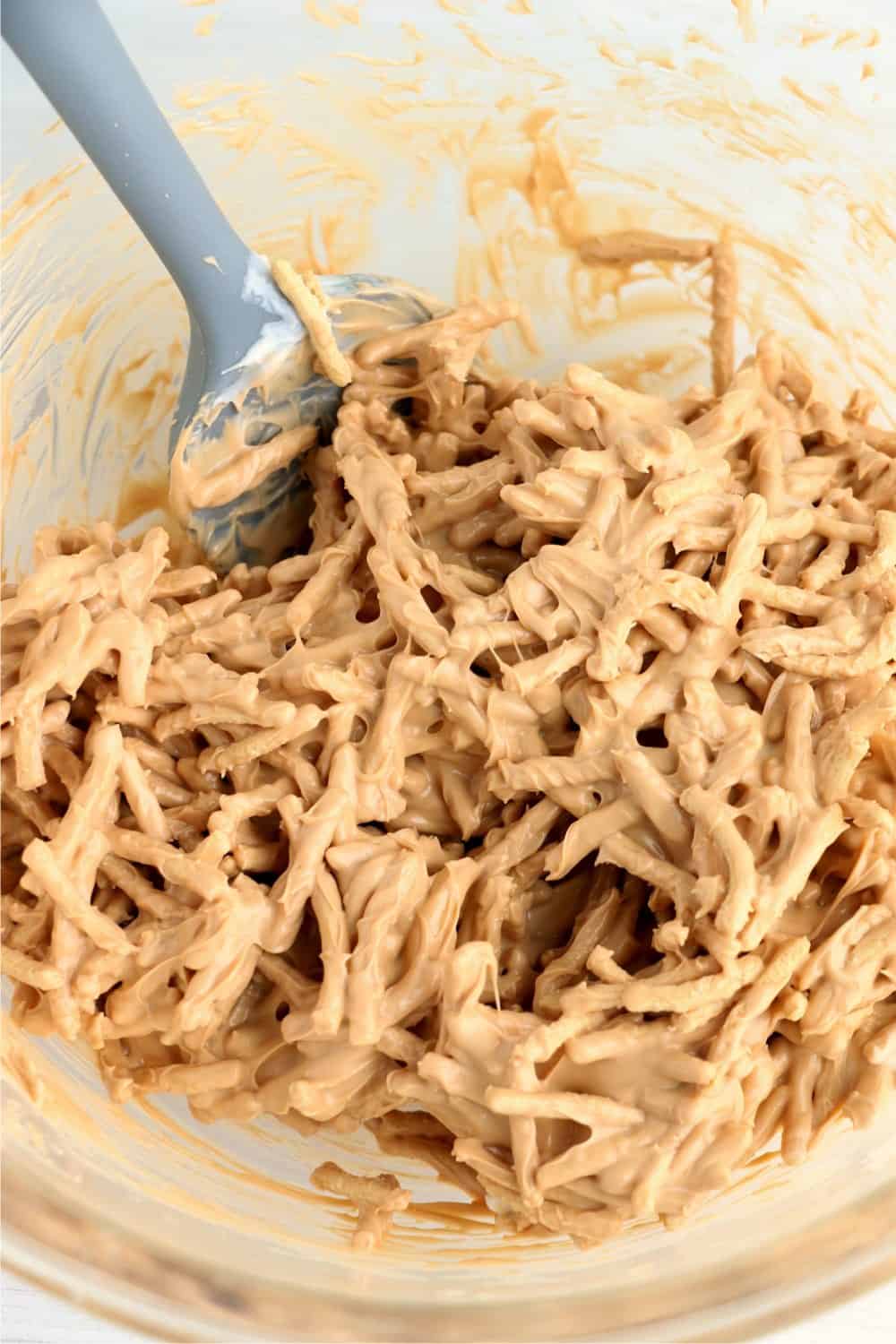 Chow mein noodles mixed into melted butterscotch chips and white bark