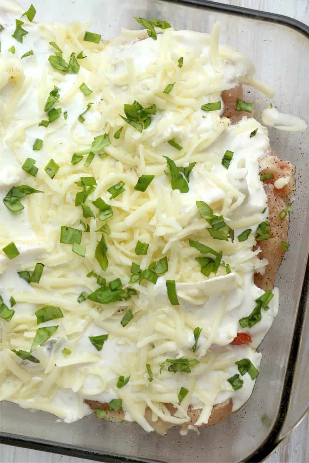 Caprese hasselback chicken prepared in a baking dish and ready to go in the oven.