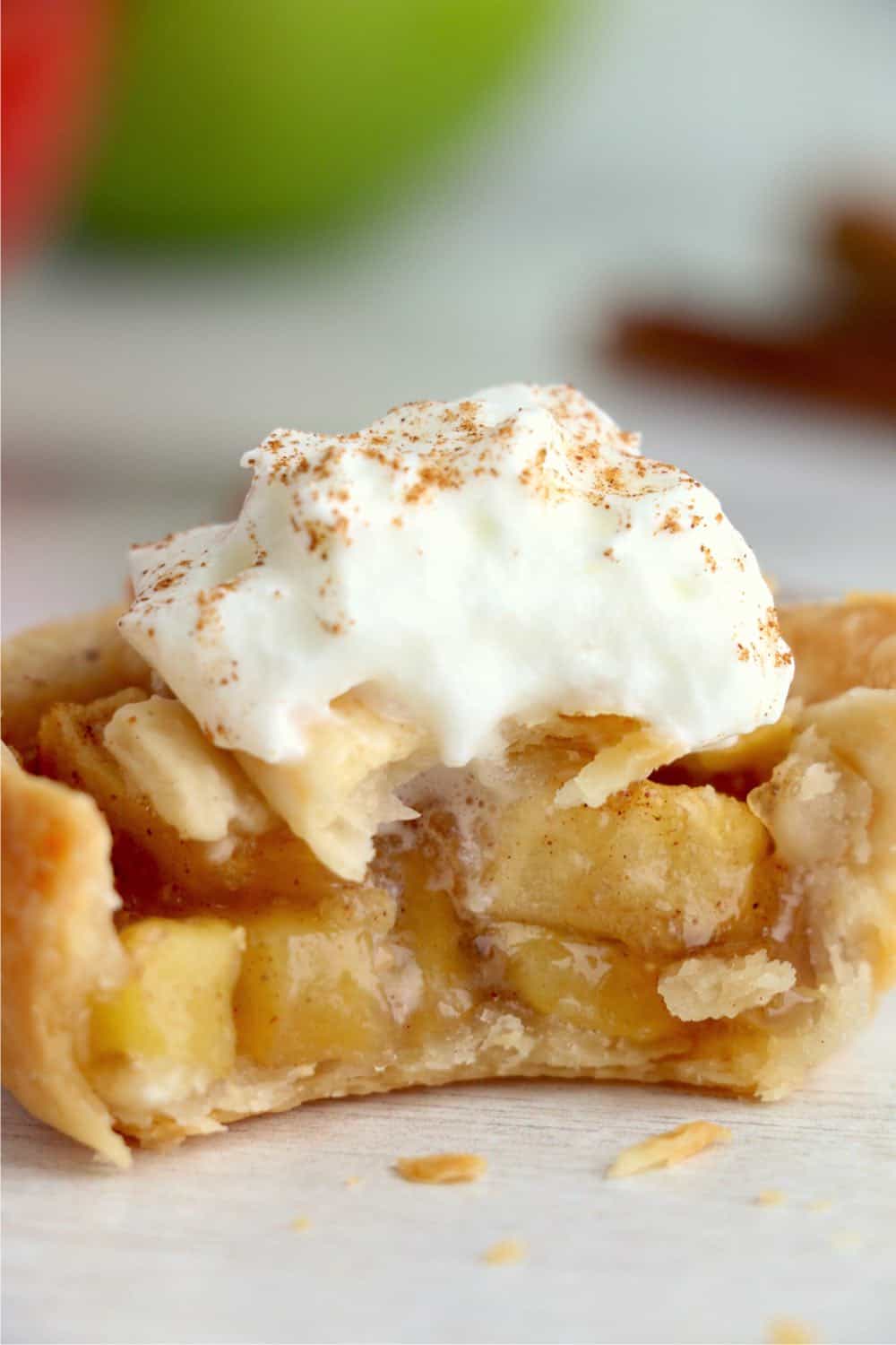 Mini apple pie with whipped cream on top