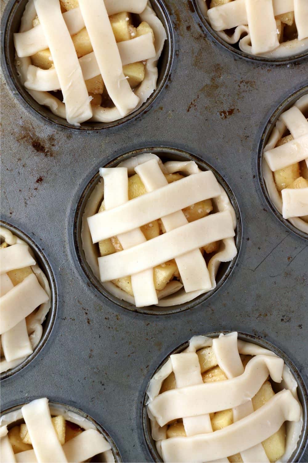 Muffin Tin Apple pies prepared and ready to go in the oven