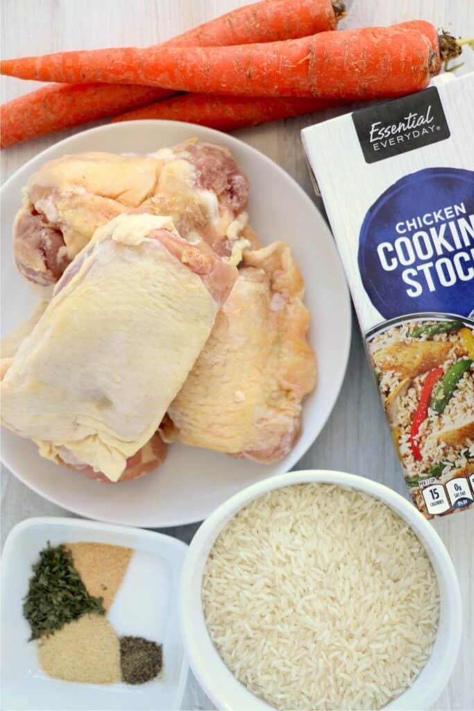 Ingredients needed for instant pot frozen chicken and rice: frozen chicken thighs, jasmine rice, chicken broth, salt, pepper, garlic powder, onion powder, parsley flakes, carrots