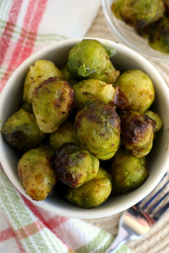 Overhead shot of air fryer frozen brussel sprouts in bowl