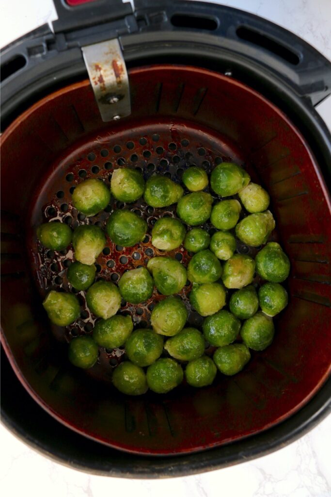 Overhead shot of frozen brussel sprouts in air fryer