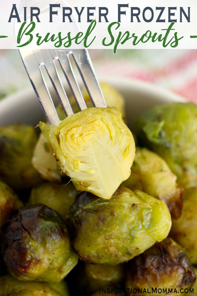 Closeup shot of forkful of brussel sprout over more air fryer frozen brussel sprouts