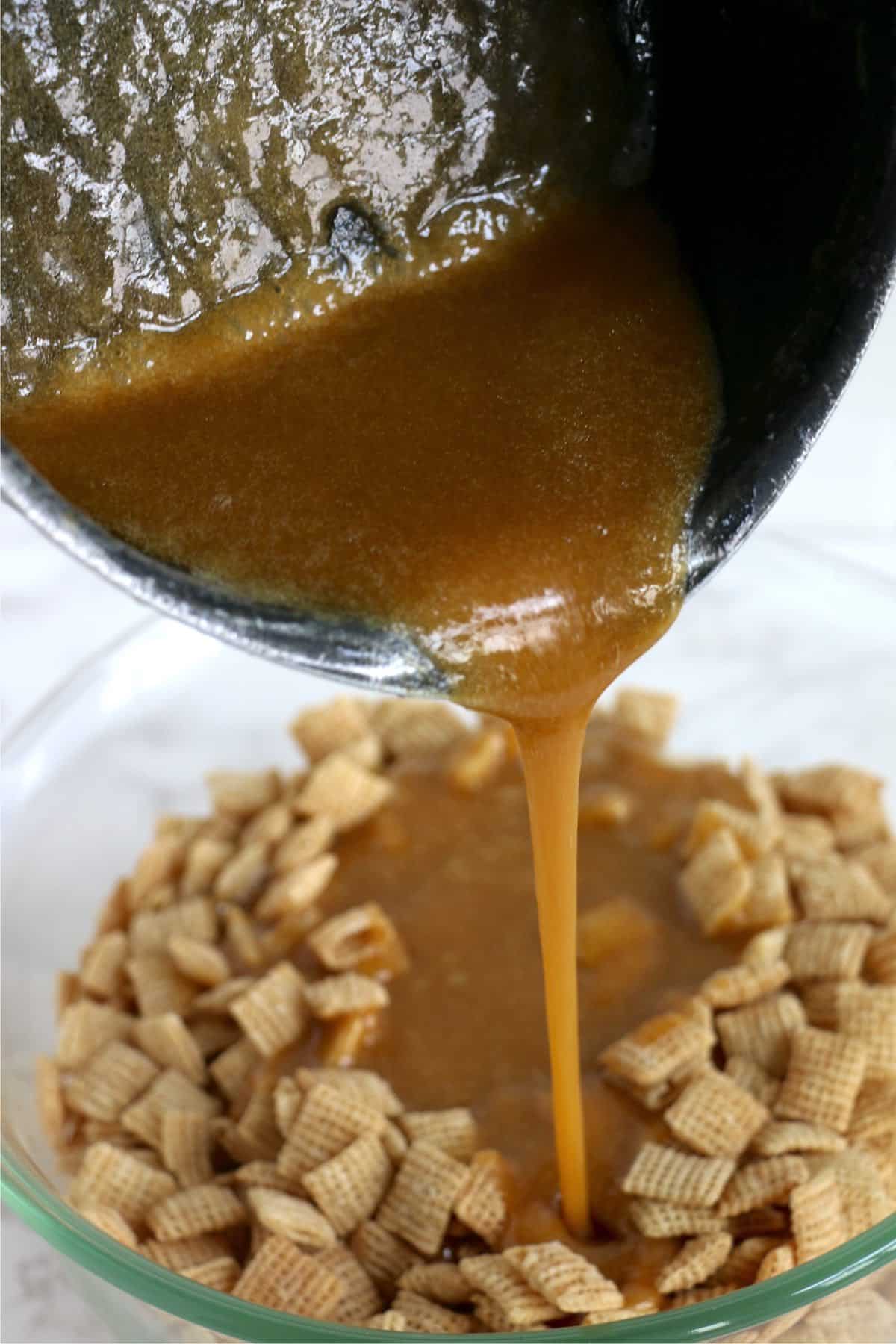 Caramel being poured over Chex cereal in a bowl