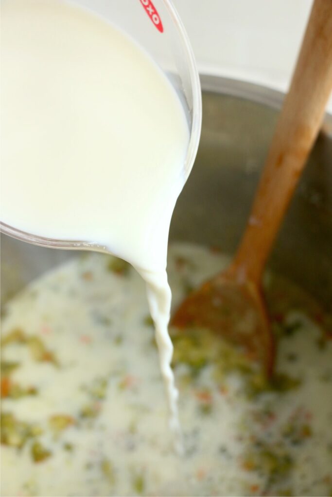 Milk being poured into soup in instant pot