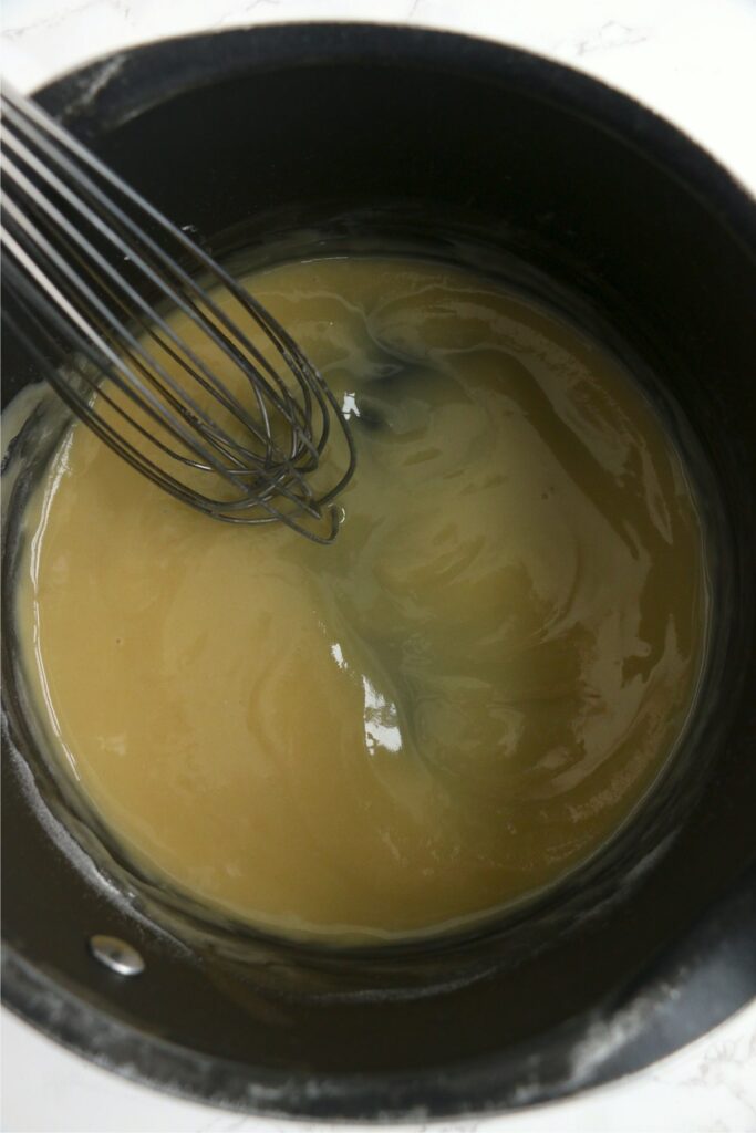 Overhead shot of whisk mixing roux in instant pot