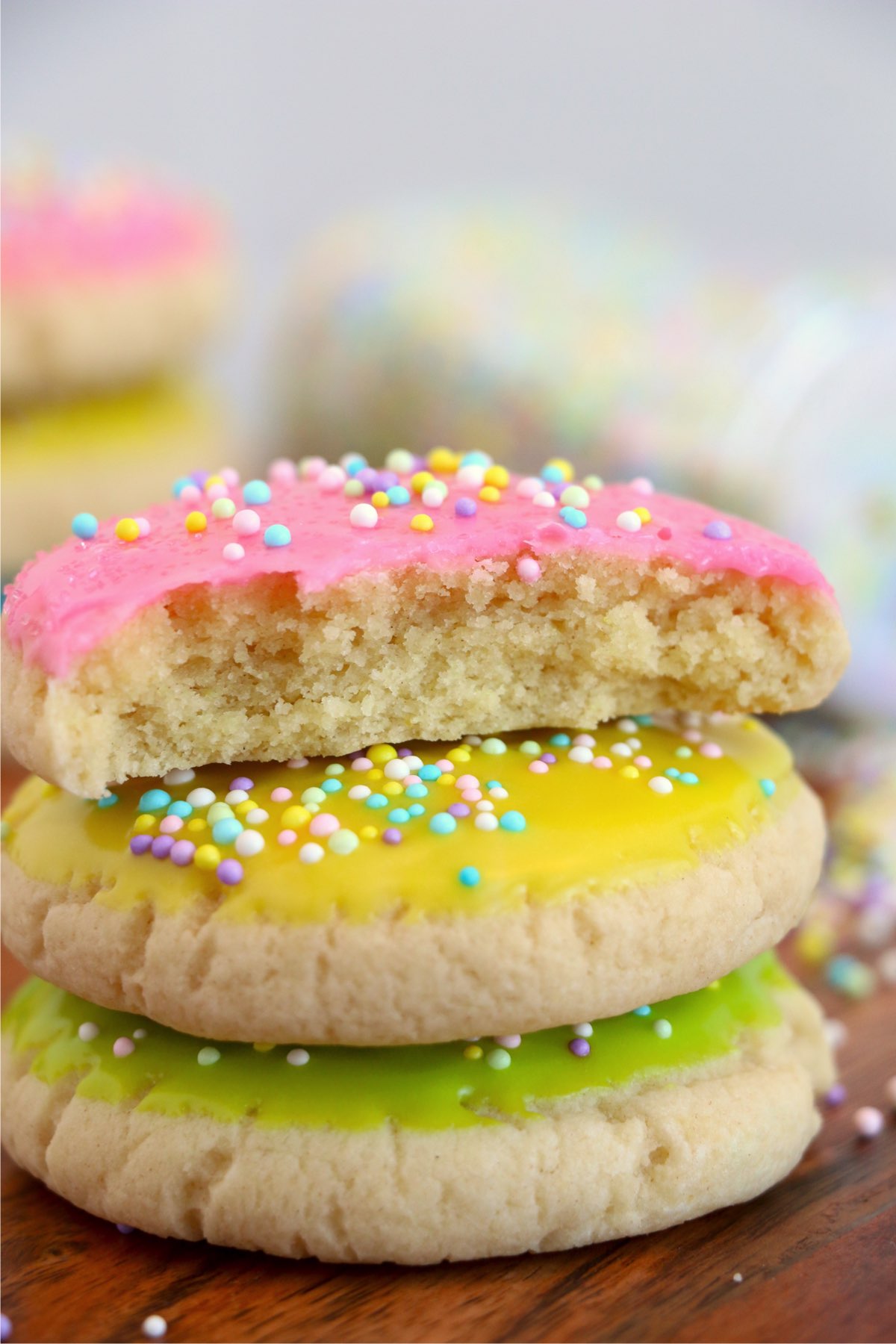 Closeup shot of three Easter sugar cookies with bite taken out of top cookie