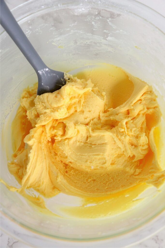 Yellow frosting in glass bowl