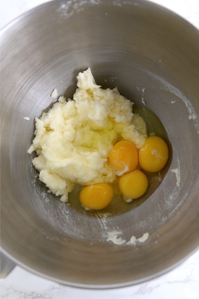 Overhead shot of eggs and creamed sugar and butter in bowl