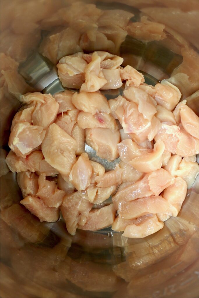 Overhead shot of chicken breast chunks in instant pot