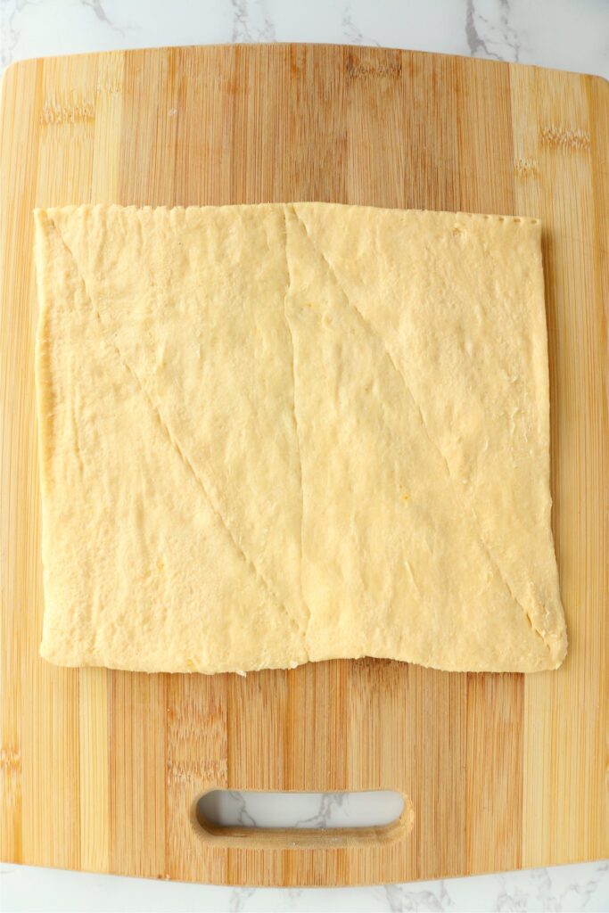 Overhead shot of crescent roll dough on cutting board