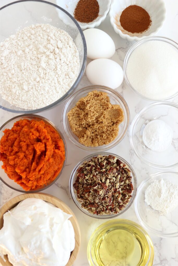 Overehead shot of air fryer pumpkin cake ingredients in individual bowls