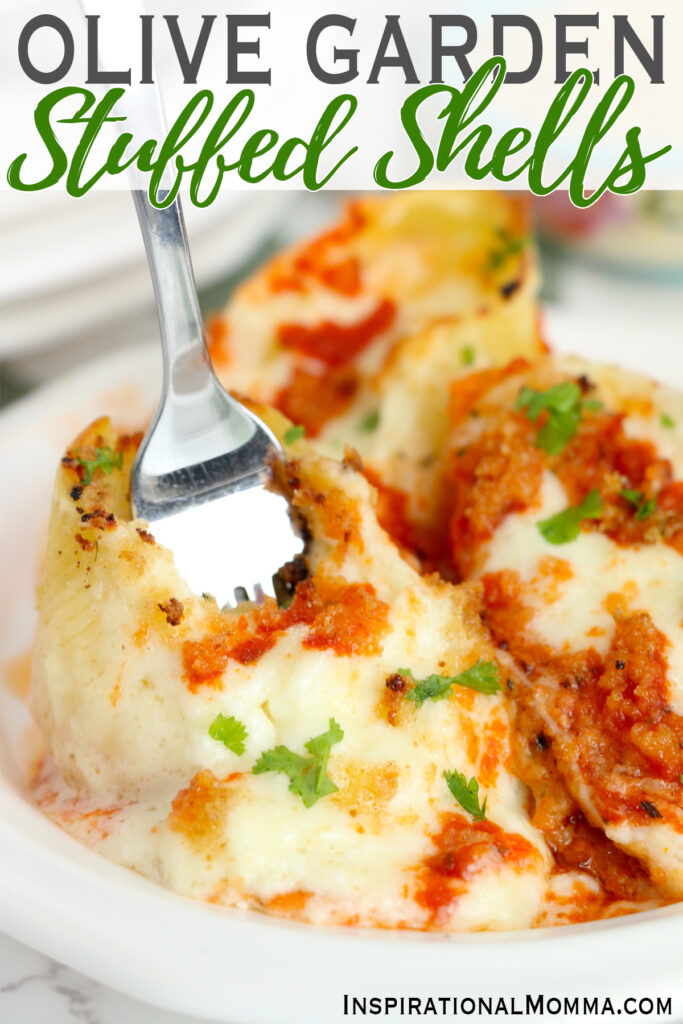 Closeup shot of fork stuck in copycat Olive Garden stuffed shells on plate