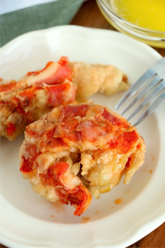 Closeup overhead shot of fried lobster tails on plate