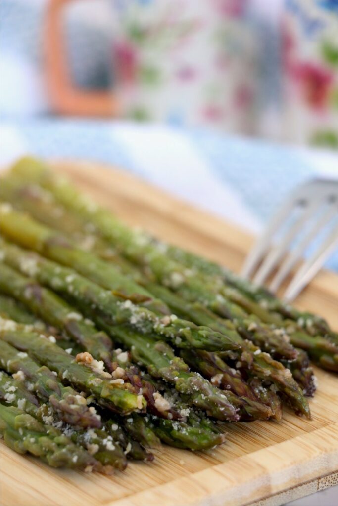 Closeup shot of instant pot asparagus on cutting board.