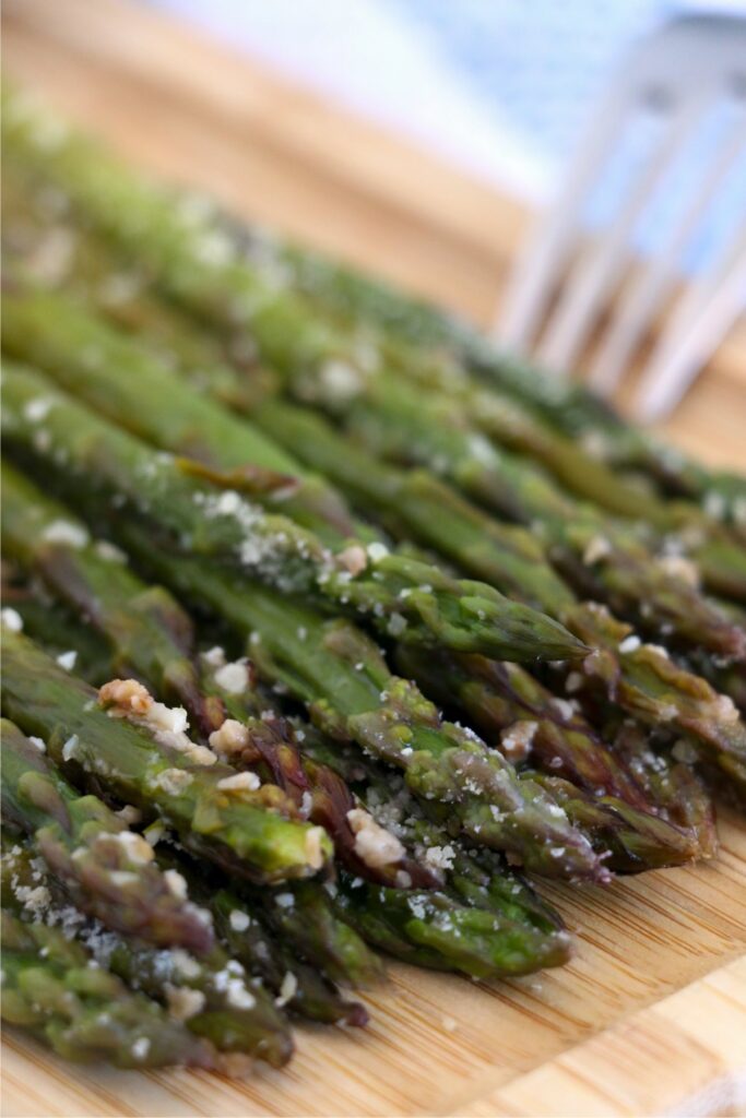 Closeup shot of instant pot asparagus on cutting baord