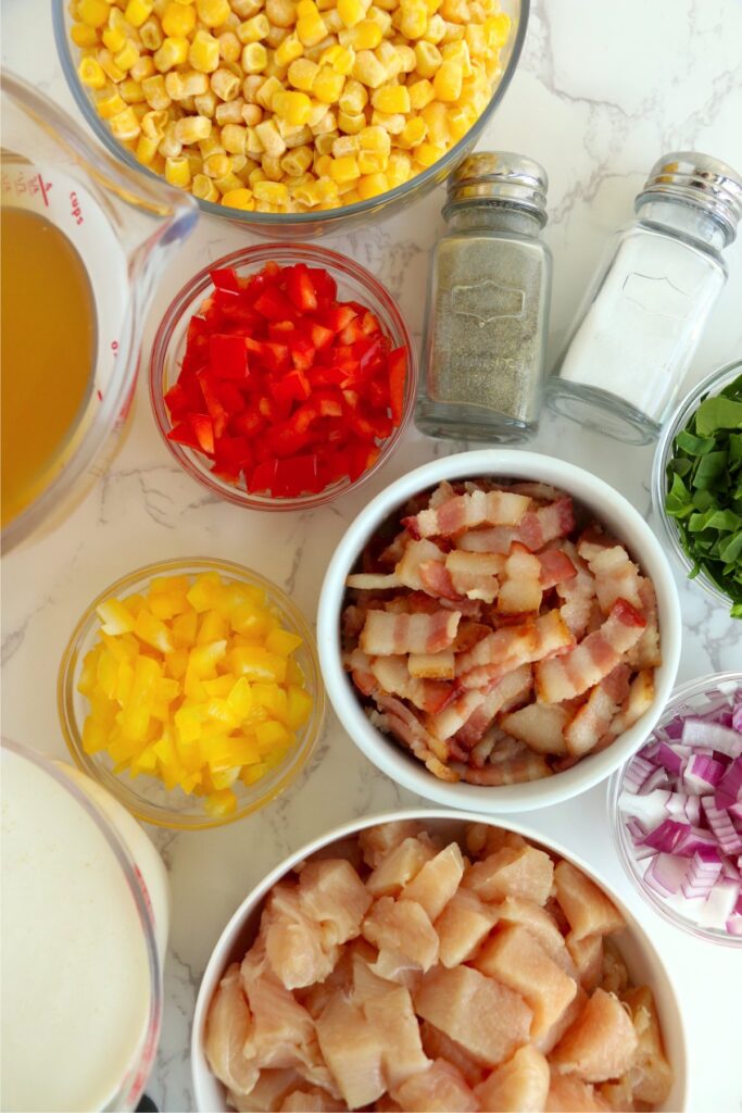 Overhead shot of chowder ingredients in individual bowls