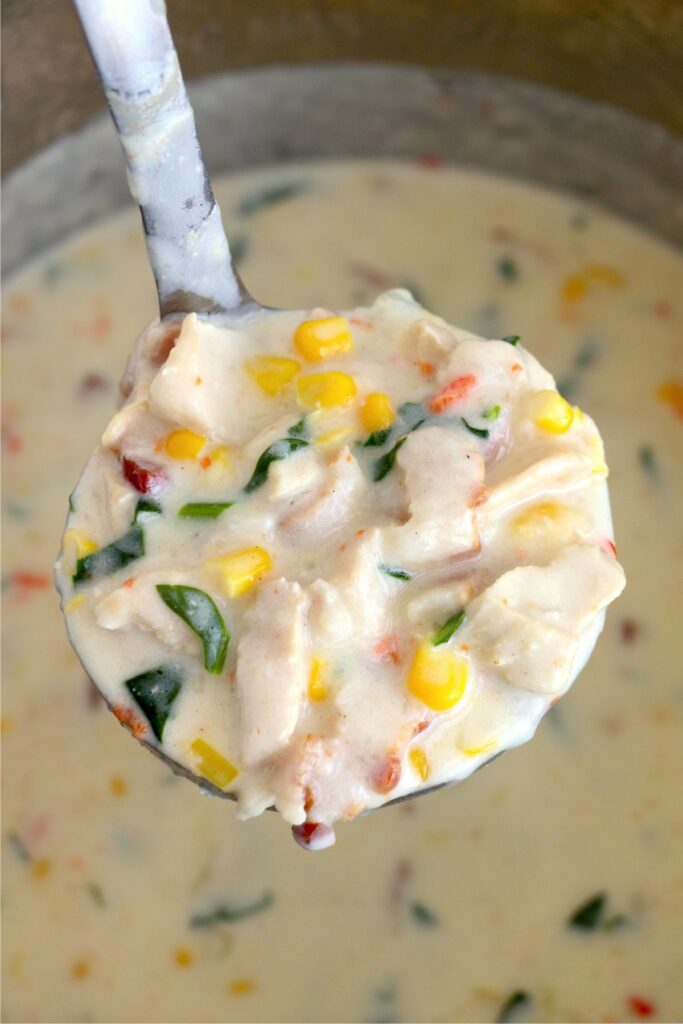 Closeup shot of ladelful of instant pot chicken corn chowder