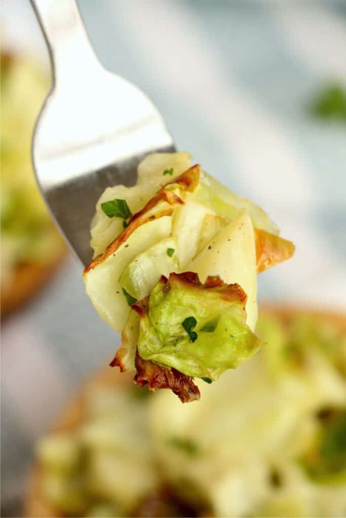 Closeup shot of forkful of air fryer cabbage.