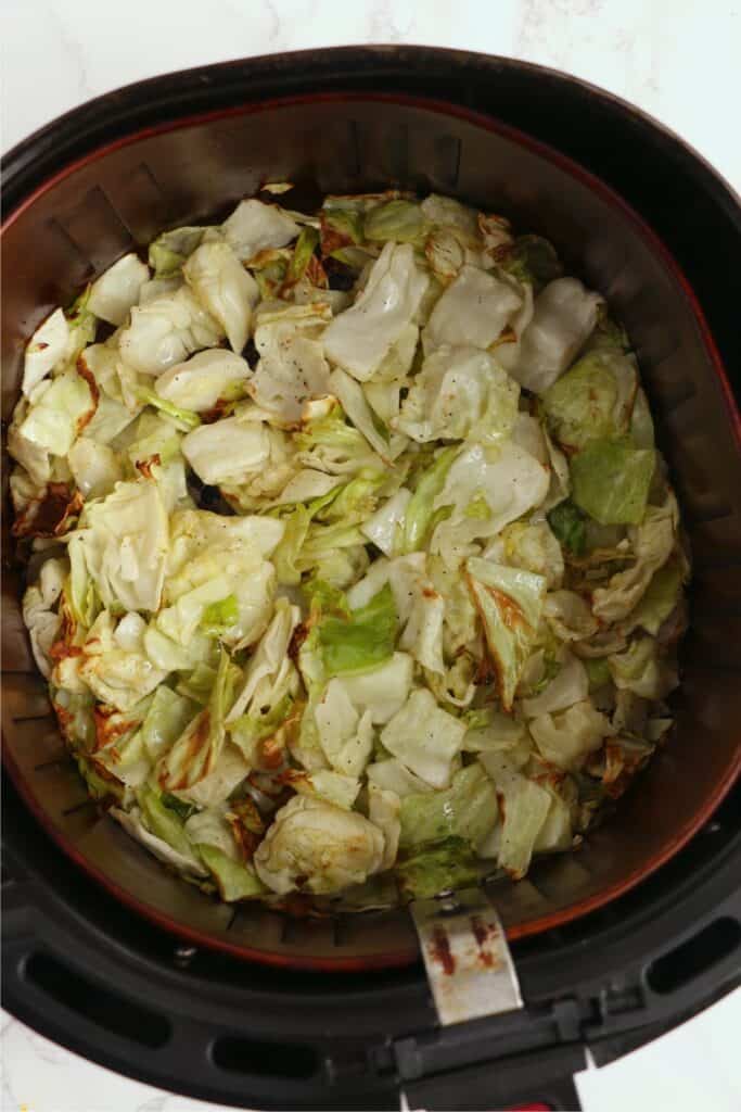 Overhead shot of cooked cabbage in air fryer