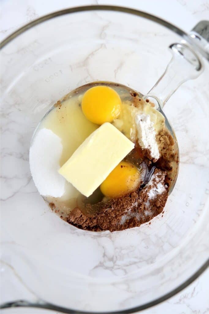 Overhead shot of brownie ingredients in glass bowl