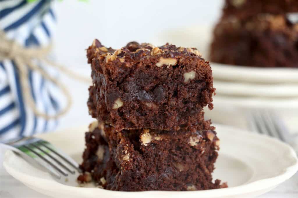 Closeup shot of two air fryer brownies stacked atop on another on plate