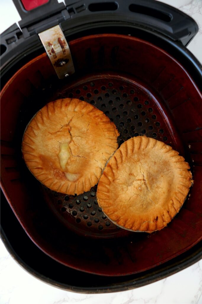 Overhead shot of cooked pot pies in air fryer