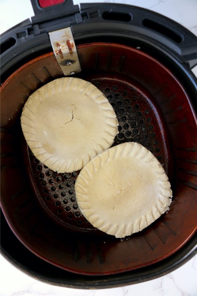 Overhead shot of frozen pot pies in air fryer