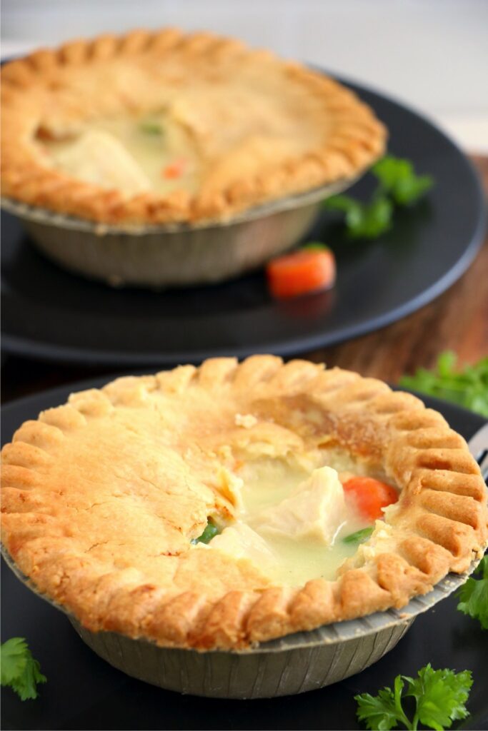 Two chicken pot pies on plates