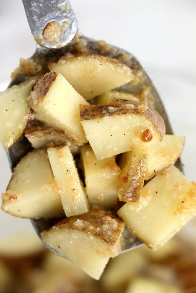 Closeup shot of potatoes coated in seasoning