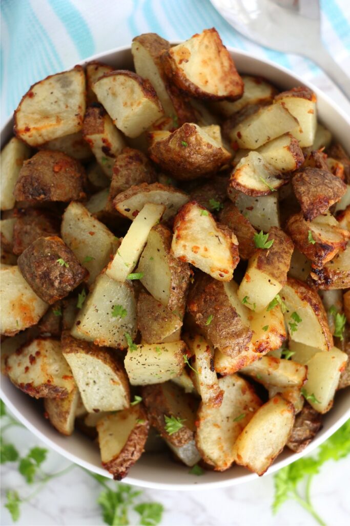 Closeup overhead shot of air fryer garlic parmesan potatoes