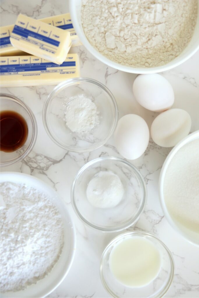 Overhead shot of individual whoopie pie ingredients in bowls on table