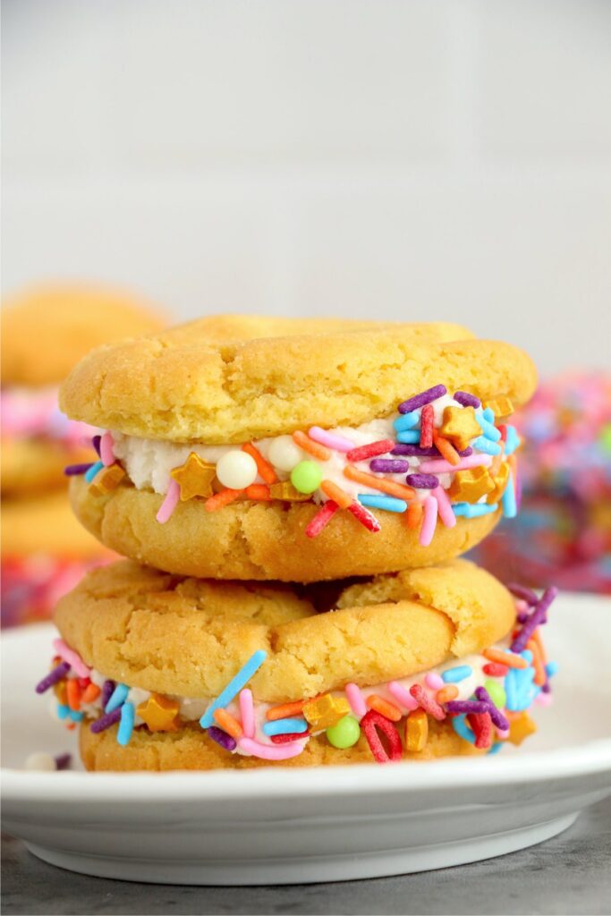 Two air fryer sugar cookie whoopie pies stacked atop one another