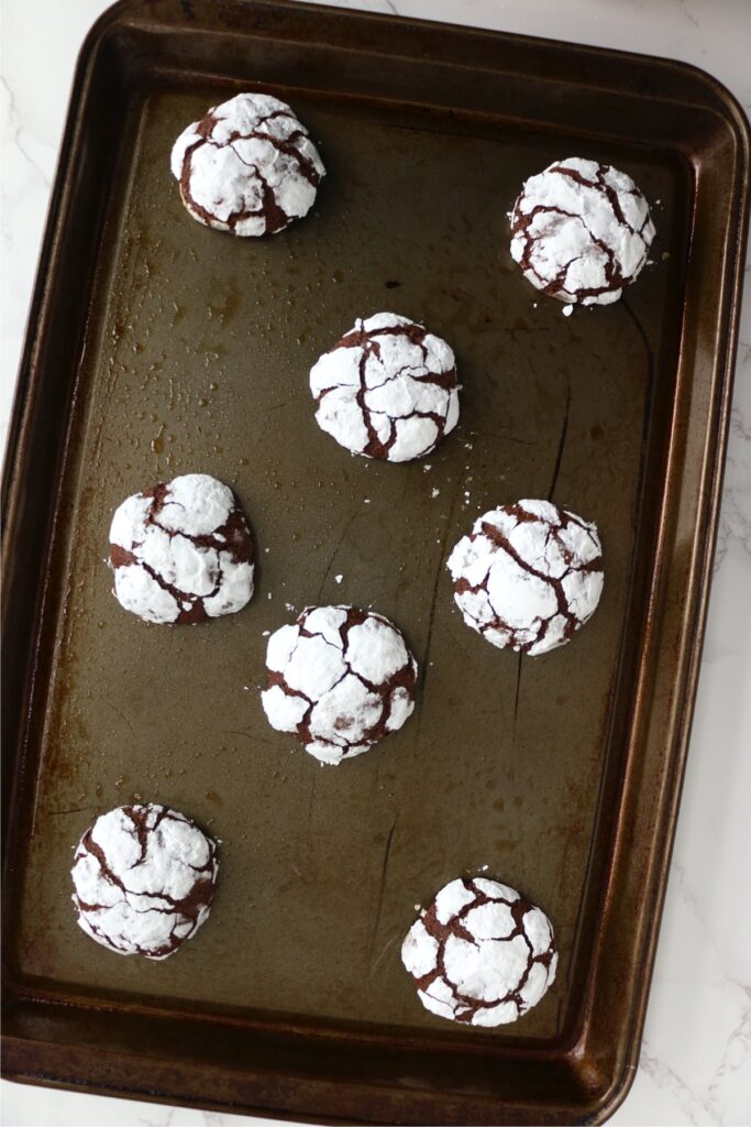 Overhead shot of chocolate crack cookies on baking sheet