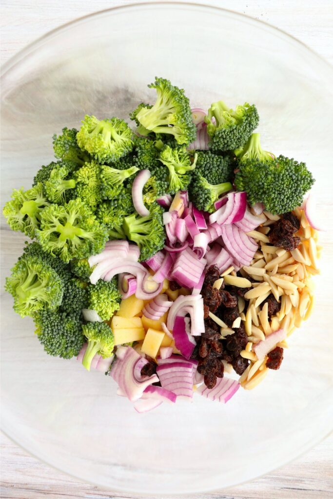 Overhead shot of veggies, fruit, and nuts in a bowl